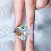 Bezel set aquamarine and diamond engagement ring by Rosec Jewels with certificate, showcasing the sparkling gemstone and elegant band.
