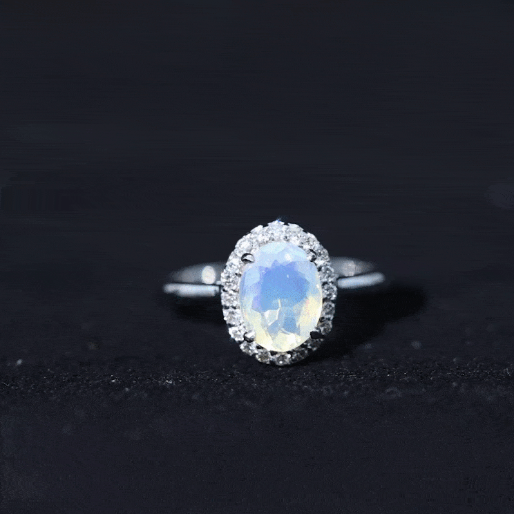 Natural Ethiopian Opal oval engagement ring with diamond halo, featuring a rose gold band and intricate detailing.