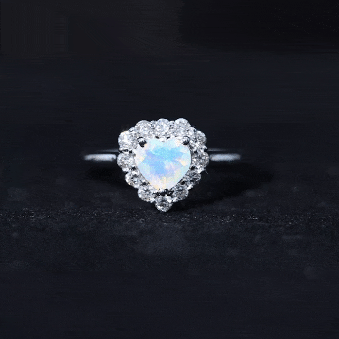 Heart-shaped engagement ring with certified Ethiopian opal and diamond halo by Rosec Jewels, showcasing a sparkling gemstone setting.