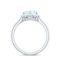 Heart-shaped Ethiopian opal engagement ring with diamond halo by Rosec Jewels, featuring a vibrant, polished gemstone and sparkling accents.