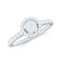 0.75 CT moonstone and diamond halo engagement ring by Rosec Jewels with intricate setting and sparkling stones.