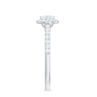 0.75 ct moonstone and diamond halo engagement ring by Rosec Jewels featuring a central moonstone surrounded by sparkling diamonds.