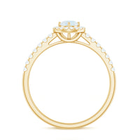 0.75 CT moonstone and diamond halo engagement ring from Rosec Jewels with intricate band and sparkling gemstone setting.