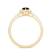 Minimal black spinel engagement ring with diamond halo from Rosec Jewels, showcasing a sleek black spinel and sparkling diamond accents.