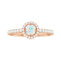 Natural Ethiopian opal diamond engagement ring with halo setting, featuring a central opal surrounded by sparkling diamonds, by Rosec Jewels.
