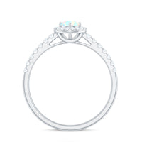 Natural Ethiopian opal diamond engagement ring with halo setting by Rosec Jewels, showcasing the sparkling center stone and elegant band.