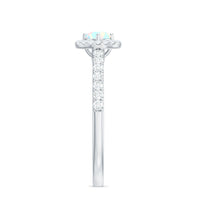 Natural Ethiopian opal diamond engagement ring with halo setting, featuring sparkling diamonds and intricate band design.