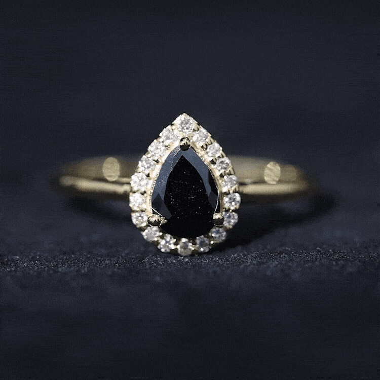 Yellow gold engagement ring featuring a black spinel teardrop center stone with diamond halo setting by Rosec Jewels.