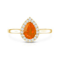 Teardrop fire opal ring with diamond accent by Rosec Jewels, showcasing the elegant gemstone and sparkling accents in a delicate ring setting.