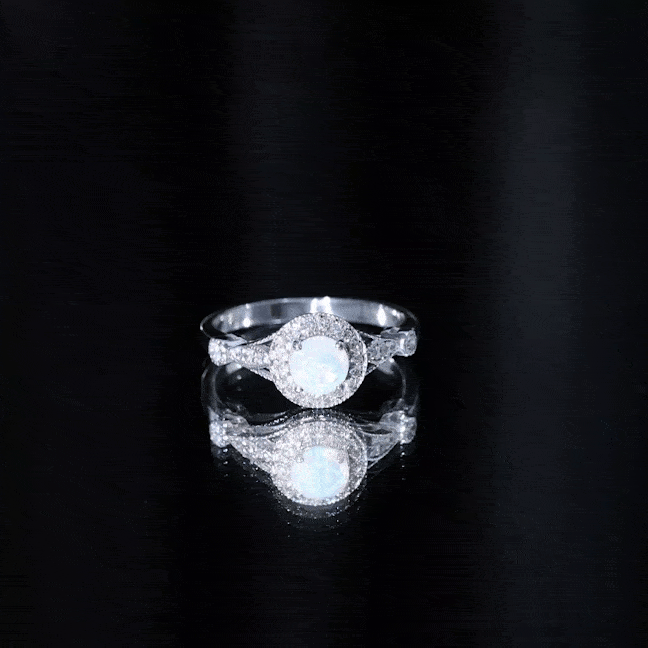 Genuine Ethiopian opal antique-style engagement ring with diamond halo, crafted by Rosec Jewels, featuring vibrant color and intricate design.