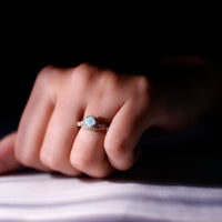 Antique-style engagement ring with genuine Ethiopian opal and diamond halo by Rosec Jewels, showcasing intricate design and sparkling stones.