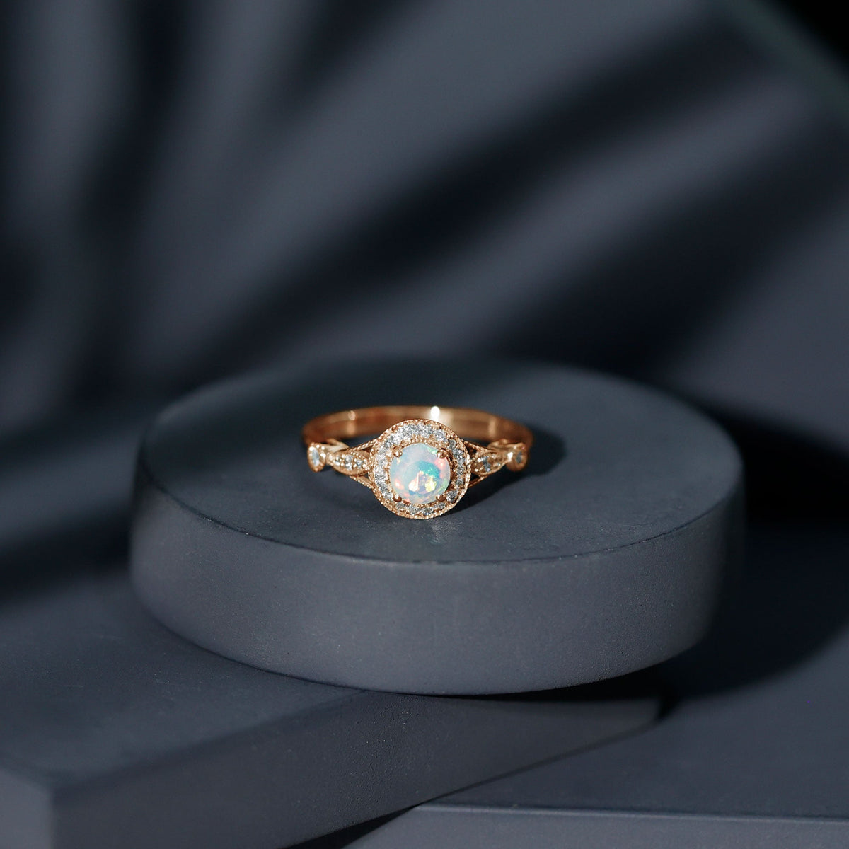 Genuine Ethiopian Opal engagement ring with antique style and diamond halo, crafted by Rosec Jewels.