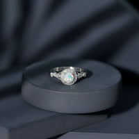 Antique-style engagement ring with genuine Ethiopian opal and diamond halo, featuring a vintage design from Rosec Jewels.