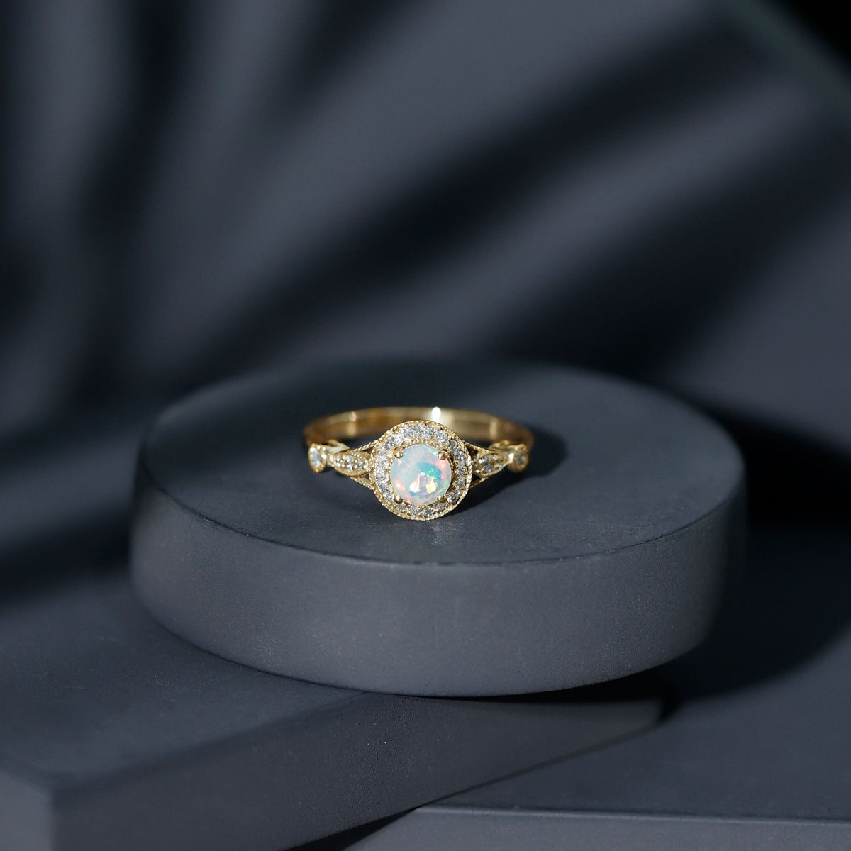 Antique-style Ethiopian opal engagement ring with diamond halo, featuring intricate design and rose gold band, by Rosec Jewels.
