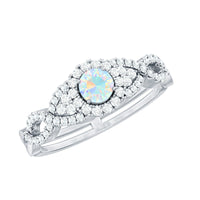 Vintage-style engagement ring with real Ethiopian opal and diamonds featuring a criss-cross shank by Rosec Jewels.