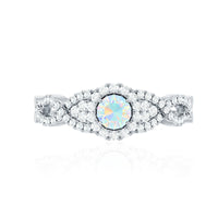 Vintage-style Ethiopian opal engagement ring with diamond accents and criss-cross shank by Rosec Jewels.