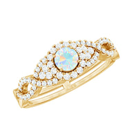 Vintage-style engagement ring with real Ethiopian opal and diamonds, featuring a criss-cross shank by Rosec Jewels.