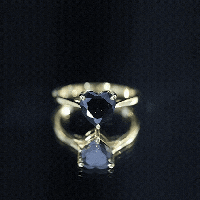 Heart-shaped black diamond solitaire promise ring by Rosec Jewels, featuring a sleek black diamond on a delicate ring band.
