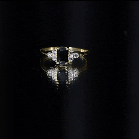Emerald cut created black diamond solitaire ring with diamond trio setting by Rosec Jewels, showcasing a sleek and elegant design.