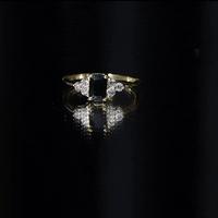 Rosec Jewels emerald cut created black diamond solitaire ring with diamond trio, showcasing a sleek, elegant jewelry design.