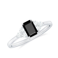 Emerald cut black diamond solitaire ring with diamond trio accent, crafted by Rosec Jewels, showcasing elegant gemstone design.