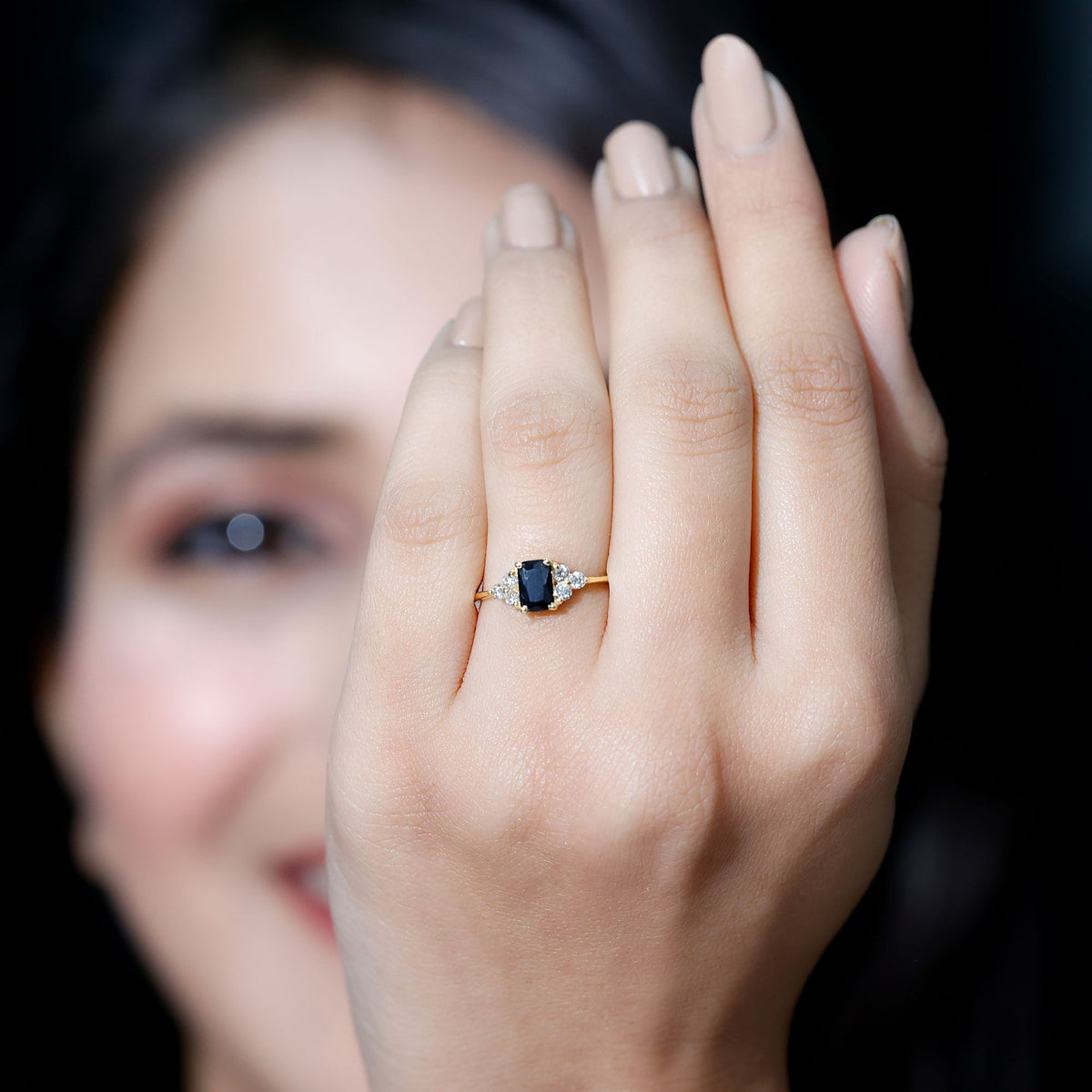 Emerald cut created black diamond solitaire ring with diamond trio accents, featuring a sleek band and elegant design by Rosec Jewels.