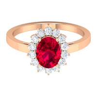 Natural 0.6 Carat Ruby Oval Engagement Ring with Diamond Halo