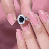 Vintage inspired black onyx oval engagement ring with diamond halo by Rosec Jewels, showcasing elegant design and sparkling gemstones.