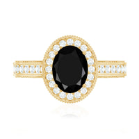 Vintage inspired black onyx oval engagement ring with diamond halo from Rosec Jewels, featuring a detailed ring design.