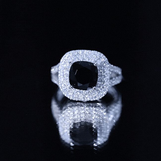 Vintage style black onyx and diamond double halo engagement ring from Rosec Jewels, featuring a cushion cut center stone.