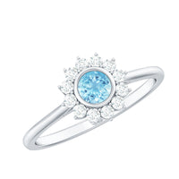 Rosec Jewels real round aquamarine and diamond halo promise ring, featuring a central aquamarine gemstone surrounded by sparkling diamonds.