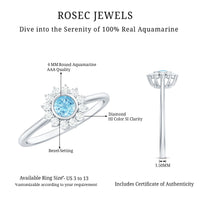 Real aquamarine and diamond halo promise ring by Rosec Jewels, featuring a round aquamarine center stone with diamond accents.