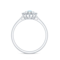 Round aquamarine and diamond halo promise ring from Rosec Jewels featuring a central aquamarine gemstone surrounded by sparkling diamonds.
