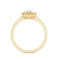 Real round aquamarine and diamond halo promise ring by Rosec Jewels, featuring a central aquamarine gemstone surrounded by sparkling diamonds.