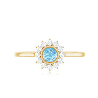 Round aquamarine and diamond halo promise ring by Rosec Jewels featuring a central aquamarine gemstone with surrounding diamonds in a silver band.