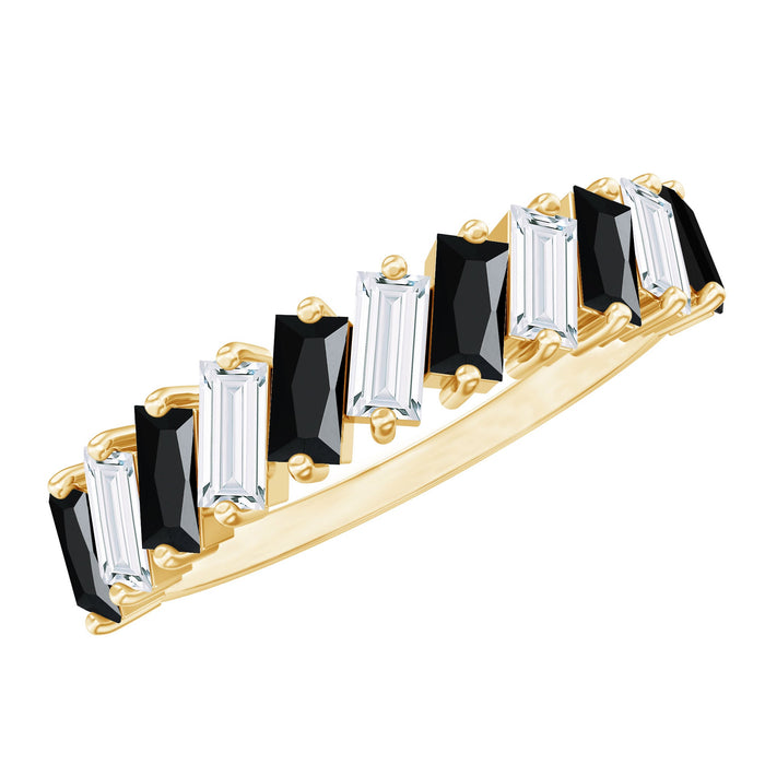 Black onyx and moissanite tilted half eternity ring with baguette cut stones, showcasing elegant jewelry design.