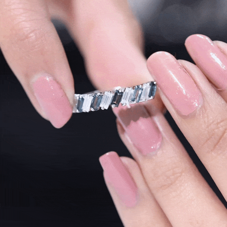 London Blue Topaz and Moissanite Baguette Eternity Ring featuring sparkling gemstones and a sleek band design by Rosec Jewels