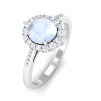 Natural moonstone engagement ring with 3/4 ct moonstone and diamond accents, showcasing elegant jewelry design.