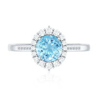 Natural 6mm aquamarine halo engagement ring with diamonds by Rosec Jewels, featuring a central aquamarine gemstone surrounded by a diamond halo.