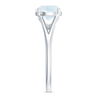 Natural moonstone solitaire ring with a surprise diamond accent, featuring a polished band from Rosec Jewels.
