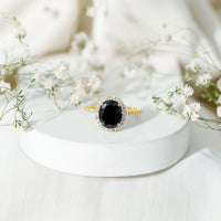 Lab grown black and white diamond oval engagement ring with halo, Rosec Jewels rings, showcasing sparkling diamonds and elegant design.
