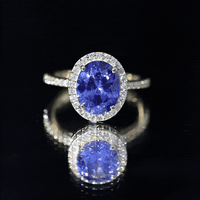 4 Carat Lab Grown Blue Sapphire Oval Engagement Ring with Diamond Halo