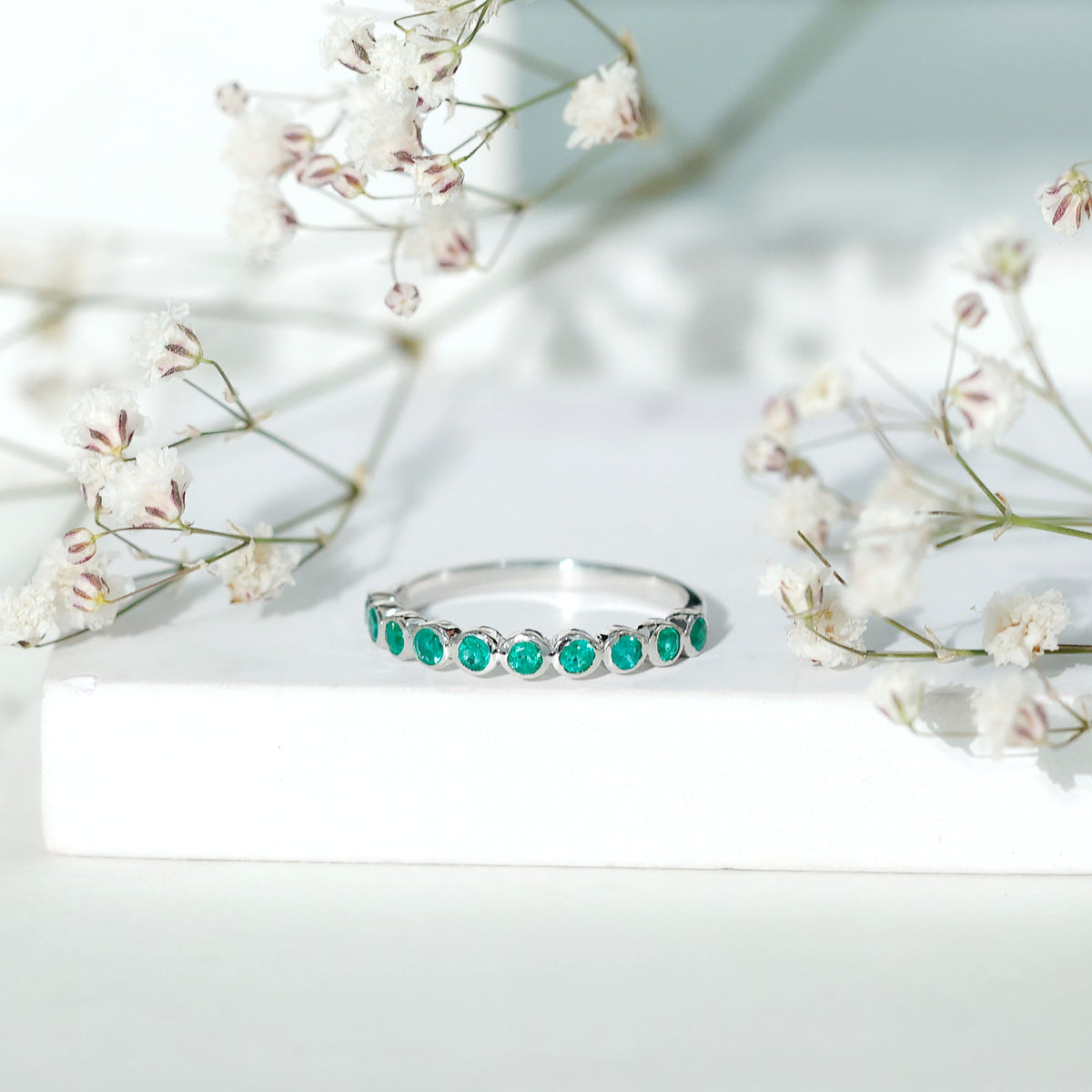 Natural Emerald Half Eternity Ring in Bezel Set