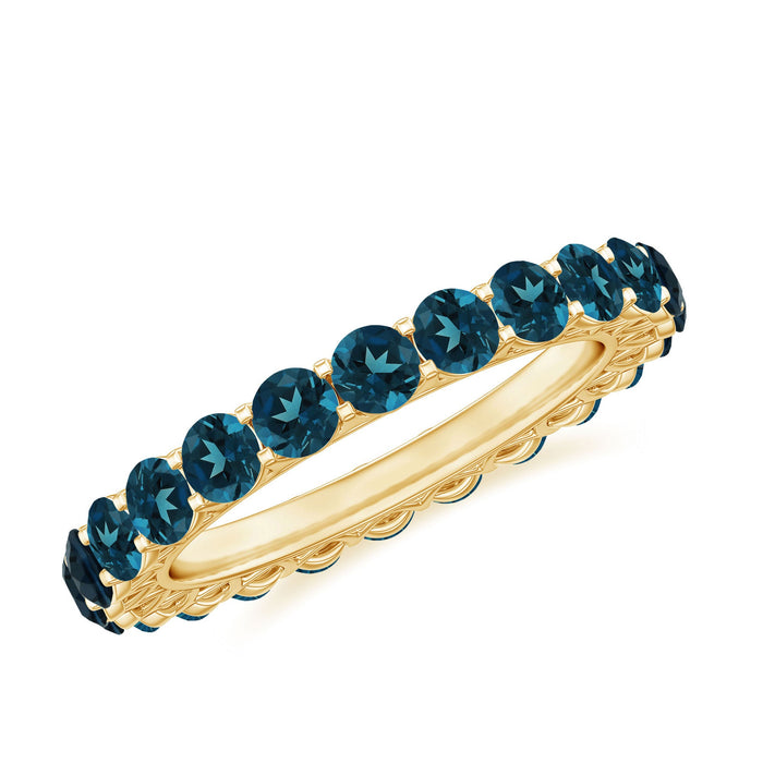 Rosec Jewels London Blue Topaz full eternity band ring with sparkling blue topaz stones encircling the silver band.