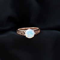 Ethiopian Opal Celtic Knot Engagement Ring with Surprise Diamond