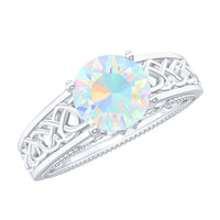 Ethiopian Opal Celtic Knot Engagement Ring with Surprise Diamond