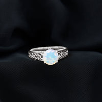 Ethiopian Opal Celtic Knot Engagement Ring with Surprise Diamond
