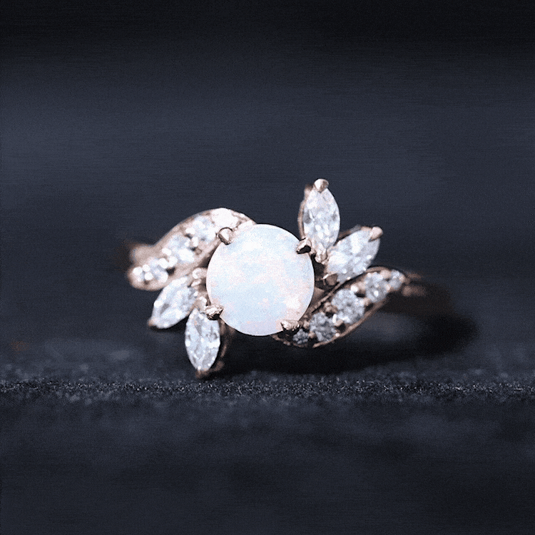 Ethiopian opal and diamond engagement ring from Rosec Jewels featuring a nature-inspired design with sparkling gemstones.