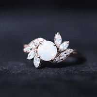 Ethiopian opal and diamond engagement ring from Rosec Jewels featuring a nature-inspired design with sparkling gemstones.