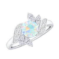 Ethiopian Opal and diamond engagement ring with nature-inspired design, set in a rose gold band by Rosec Jewels.